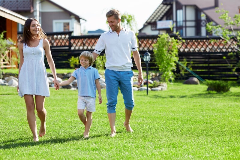 family_walking_lawn